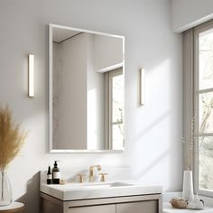 a bathroom with a sink, mirror and window