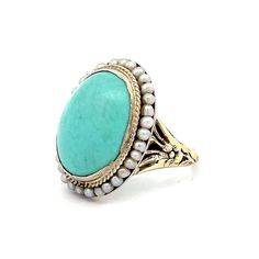 This exquisite Victorian cocktail ring captures the charm and elegance of the era. At its center is a stunning 5.83 carat oval cabochon cut turquoise, radiating a serene blue hue. Surrounding the turquoise are thirty-two delicate seed pearls, each measuring 1.5 mm, adding refinement to the ring. Crafted in polished 14 karat yellow gold, the bezel setting securely holds the turquoise, while the floral engravings on the band reflect the intricate craftsmanship of the Victorian period. Despite minor wear due to its age, this ring's delicate nature enhances its historical allure. Ideal for special occasions or as a collector's treasure, this Victorian cocktail ring exudes antique charm. Add this beautiful piece to your collection and enjoy a piece of history. Antique Turquoise Gemstone Ring For Formal Occasions, Oval Yellow Gold Turquoise Ring With Cabochon, Oval Turquoise Cabochon Ring In Yellow Gold, Formal Fine Jewelry Turquoise Cabochon Ring, Formal Turquoise Cabochon Ring Fine Jewelry, Formal Turquoise Cabochon Ring, Antique Oval Turquoise Ring For Wedding, Antique Oval Turquoise Ring, Antique Oval Turquoise Wedding Ring