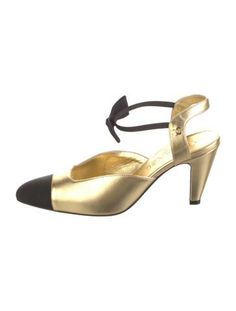 Chanel Leather Slingback PumpsFrom the Pre-Fall 2020 Collection by Virginie ViardGold & MetallicInterlocking CC LogoGrosgrain & Bow AccentsSemi-Pointed ToesStrapsDesigner Fit: This style typically runs narrow and a half size small.Unfortunately, due to restrictions, this item may not be eligible for shipping in all areas. Chanel Slingback Shoes Two Tones, Chanel Two Tone Pumps, Chanel 2020, Men Earrings, Vintage Holiday Dress, Cc Logo, Chanel Shoes, Slingback Pump, Accessories Jacket