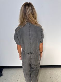 A classic utility-style jumpsuit in an ash grey wash tencel. Tencel Relaxed fit Short sleeve Long straight leg Collared neckline Button front top Zip fly closure Front patch pockets Back patch pocket Utility jumpsuit A jumpsuit to wear on repeat all spring and summer long. Featuring the perfect relaxed fit, our utility-style one-piece is crafted from lightweight tencel and features a button-front top and collared neckline. Short sleeves keep things breezy, while the straight long leg pairs well Hair Socks, Utility Jumpsuit, Style Jumpsuit, Casual Bodysuit, Utility Style, Overalls Pants, Baby Pajamas, Button Front Top, Grey Wash