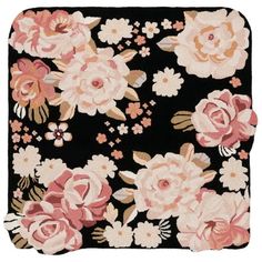 a black and pink rug with flowers on it