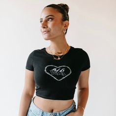 Tight fitted crop top. Models are wearing size XS/S. Size up for a looser fit. 52% combed ring-spun cotton, 48% polyester. Edgy Cotton Cropped T-shirt, Fitted Cropped T-shirt For Streetwear, Edgy Cropped T-shirt For Streetwear, Fitted Edgy Cropped T-shirt, Edgy Fitted Cropped T-shirt, Edgy Fitted Crop Top T-shirt, Basic Fitted Cropped T-shirt For Streetwear, Edgy Cropped Top For Streetwear, Edgy Stretch Crew Neck Crop Top