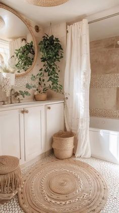 a bathroom with a rug, mirror and potted plant on the wall in it