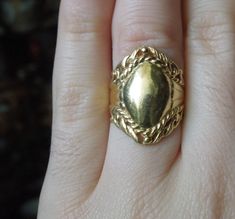 "Vintage Mid-Century Circa 1960 Constructed of Sterling Silver Accented with a Gold Plating Top section of ring measuring approximately 1\" in length --Refer to photo on finger in natural daylight-- Inside shank: 925 Finger Size 6 (Sizing upon request; Additional fees may apply) Weighing 5.9 grams *Sale of ring includes an appraisal certificate for your insurance purposes. All pieces shipped insured via USPS Priority Mail requiring signature upon delivery. Specialty gift wrap upon request at no Vintage Jewelry With Ring Detail For Formal Occasions, Vintage Formal Jewelry With Ring Detail, Vintage Gold Engraved Ring, Vintage Ceremonial Jewelry Metal Ring, Vintage Ceremonial Metal Ring Jewelry, Vintage Ceremonial Rings With Polished Finish, Vintage Oval Jewelry With Ring Detail, Signet Rings, Bezel Ring