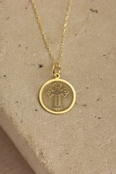 Gold Cross Pendant - Cross Gold Necklace ● Material of pendant: Solid Gold 14k ( REAL GOLD ) ● Metal Stamp: 14k ( REAL GOLD ) ● The pendant is available in 5 sizes: - 12,7 mm / 0.5 inches (Diameter) - 14,0 mm / 0,55 inches ( Diameter ) In the photos - 15,3 mm / 0.6 inches ( Diameter ) - 16,5 mm / 0,65 inches ( Diameter ) - 19,1 mm / 0,75 inches ( Diameter ) ( In the photos the size is 14mm / 0.55 inches Diameter ) ( Jump Ring inner diameter: 4 mm ) ● Material of chain: Solid gold 14k ( REAL GOLD Yellow Gold Coin Pendant For Commemoration, Spiritual Yellow Gold Medallion Charm Necklace, Gold Crucifix Necklace In 14k Gold, 14k Gold Spiritual Round Pendant Charm Necklace, Symbolic Yellow Gold Cross Jewelry, Spiritual 14k Gold Charm Necklace With Round Pendant, Gold Plated Spiritual Round Pendant, Spiritual Yellow Gold Pendant Necklace, Gold Crucifix Jewelry Stamped 14k