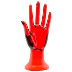 a red plastic hand that is on top of a table