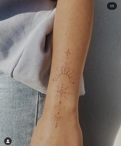 a person with a tattoo on their arm