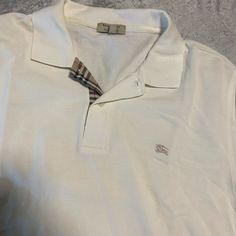 Amazing Condition Super High Quality Mens True To Size Super Highly Fashionable And Credible Company Burberry Comes This Vintage Piece Kept In An Amazing Clean House For Many Years Unworn In Great Condition, White Long Sleep And Size Mens Xl True To Size White Cotton Top With Casual Collar, Classic White Polo Shirt, Burberry Shirts, White Long Sleeve, Cream White, Clean House, Vintage Style, Burberry, Colorful Shirts