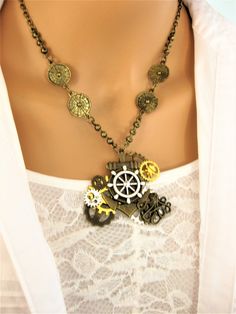 I created this assemblage style Steampunk necklace with a large brass anchor charm, a silver metal ship wheel charm, a brass octopus charm, and multi colored steampunk gears. Unique handmade necklace for women or men, unisex jewelry. The necklace chain is brass antique gold metal. There are 4 round brass stamped metal links on the chain, and large detailed brass links. The necklace is 18 inches, and has a lobster clasp. The pendant is about 2 inches tall by 2 inches wide. This necklace, and coul Steampunk Metal Necklaces For Festivals, Steampunk Metal Necklace For Festivals, Handmade Steampunk Metal Necklace, Handmade Steampunk Jewelry For Festivals, Octopus Necklace, Assemblage Necklace, Style Steampunk, Anchor Charm, Steampunk Gears