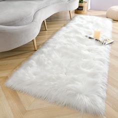 PRICES MAY VARY. Like the Real Fur: A more ethical choice for animal life, and embrace the soft, luxurious feel the same as real fur from this gorgeous faux fur rug. The Luxury of Softness: With over 3-inch plush and its natural gloss, our faux sheepskin rug is super soft and cozy to step on when you get out of bed, warming up your feet since the day begins. Premium Suede Backing: The fluffy bedroom rug with high-end suede backing, unlike other brands who use pvc or dots which will break down as White Faux Fur Rug, Faux Fur Rugs, Fluffy Bedroom, Fur Rugs, Fuzzy Rug, Faux Sheepskin Rug, Home Decor White, Sheepskin Throw, Room Girls