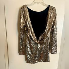 Perfect Condition, Never Worn Party Dress. Long Sleeve Backless, Sits Well At Mid Thigh. Fits Sm/Med. Glamorous Festive Sequin Dress For Night Out, Gold Mini Dress For Night Out, Gold Dresses For Prom Season, Glamorous Gold Mini Dress For Holiday Party, Gold Mini Dress For Cocktail Parties, Festive Sequin Dress For Night Out, Festive Party-ready Sequin Dress For Night Out, Backless Sequin Party Evening Dress, Chic Gold Sequin Party Dress