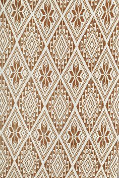 a brown and white pattern on fabric