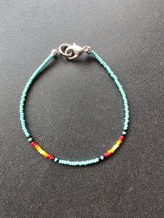 This simple beaded bracelet is a colorful addition to your breezy summer wardrobe. You'll want to wear this as you head out the door to your summer events. These bracelets are 7inches and have a lobster clasp for a great fit! I have 6 to offer so, you'll want to order now to ensure that this design is yours in time for your next event. Everyday Multicolor Beaded Chain Bracelets, Casual Beaded Chain Bracelets For Summer, Summer Hand-strung Beaded Bracelets, Turquoise Friendship Bracelets With Tiny Beads For Summer, Summer Friendship Bracelets With Tiny Turquoise Beads, Turquoise Friendship Bracelet With Tiny Beads, Hand-strung Beaded Bracelets For Everyday Summer, Summer Hand-strung Bracelets With Round Beads, Turquoise Summer Friendship Bracelet With Tiny Beads