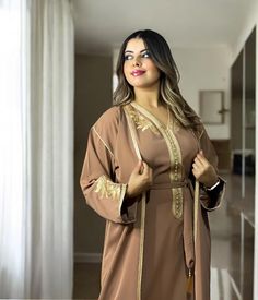 Gold Embroidered Floor-length Thobe, Embroidered Gold Floor-length Thobe, Festive Embroidered V-neck Thobe, Festive V-neck Embroidered Abaya, Embroidered V-neck Abaya For Wedding, Festive Long Brown Kaftan, Elegant Brown Festive Kaftan, Festive Brown Elegant Kaftan, Embroidered V-neck Wedding Abaya