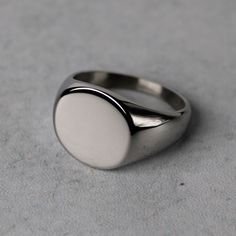 Premium Stainless Steel Color: Steel Height: Approx 15mm Width: Approx 17mm Available Sizes 7 / 8 / 9 / 10 / 11 / 12 (Choose Your Us Ring Size) Safe In Water No Tarnish No Green Finger Also Available In Gold Minimalist Stainless Steel Signet Ring, Classic Oval Stainless Steel Rings, Oval Stainless Steel Signet Ring As Gift, Oval Stainless Steel Signet Ring For Gift, Modern White Oval Signet Ring, Modern White Round Signet Ring, Classic White Oval Signet Ring, Classic Oval White Signet Ring, Unisex Rings