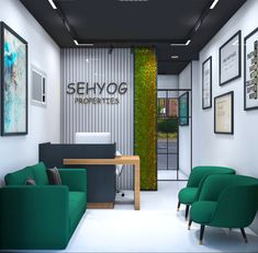 an office with two green chairs and a desk in front of a wall that says sehyog properties