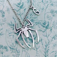 Tarantula necklace, tarantula jewellery, spider lover gifts, spider inspired gifts, spider pendant necklace, gothic necklace, pet spider, Why not have a go at the LUCKY DIP https://www.etsy.com/listing/1095282417/charm-necklace-jewellery-lucky-dip-charm Add on a PERSONALISED GIFT BOX  https://www.etsy.com/listing/1170103232/add-gift-boxes-to-your Add on a bestfriend charm https://www.etsy.com/listing/1185120378/add-a-best-friend-charm-to-any-piece-of Materials * 19mm silver spider charm  * 6mm s Spider Inspired Jewellery, Halloween Gift Metal Necklace, Gothic Pendant Necklace Gift, Gothic Pendant Necklace As Gift, Gothic Pendant Necklace For Gift, Adjustable Halloween Necklace For Gift, Halloween Gift Necklace With Lobster Clasp, Unique Halloween Pendant Necklaces, Halloween Themed Silver Necklaces