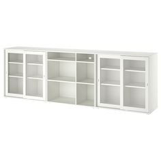 a white bookcase with glass doors on the front and bottom shelves in different sizes