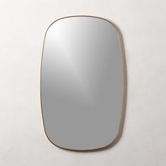 a mirror on the wall with a white background