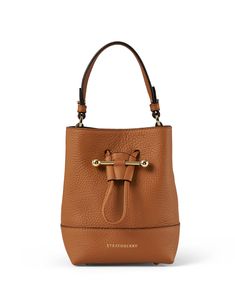 The Lana bucket bag is casual, chic and functional, making it perfect for everyday wear. The bucket silhouette is cut from premium leather, closes with a drawstring closure, and features a detachable crossbody strap for easier wear. Style it with easygoing dresses and sleek separates to instantly elevate any look. Luxury Rectangular Bucket Bag With Snap Closure, Luxury Brown Bucket Bag With Zipper Closure, Luxury Vintage Brown Bucket Bag, Luxury Brown Bucket Shaped Bag, Luxury Bucket-shape Shoulder Bag For On-the-go, Luxury Bucket Shoulder Bag For On-the-go, Luxury Satchel Bucket Bag, Travel Bucket Bag With Gold-tone Hardware, Luxury Bucket Bag For On-the-go