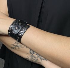 Black Genuine Leather Bracelet 100% Genuine Leather Band 8.26in /21cm long x 1.37in /3.5cm wide. Nickel metal appliques.  It is adjustable in 2 sizes 7.48in /19cm and 6.69in /17cm. Beautiful genuine leather bracelet that adds a rocker touch to your outfit. Top quality materials. Comfortable to wear on any occasion. It can be combined with other bracelets.   It gives you a modern style! Why choose genuine leather bracelets? -Genuine leather is known for being extremely durable and resistant to we Black Cuff Bracelet, Handmade Leather Jewelry, Womens Cuff Bracelets, Outfit Top, Genuine Leather Bracelet, Leather Diy Crafts, Nickel Metal, Leather Cuffs Bracelet, Leather Bracelets