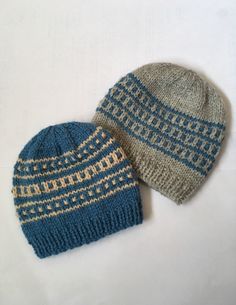 two knitted hats sitting next to each other