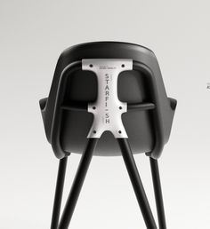 a black and white chair with legs that are attached to it's back end