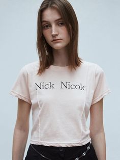 This short-sleeve T-shirt from NICK&NICOLE features the Nick Nicole logo lettering as a focal point. The pintuck detail on the front makes it suitable for statement wear.- Slim fit that makes your body curves accentuated- The cropped length elongating the legs- A versatile item with a vintage yet casual mood Spring Logo Print Short Sleeve Tops, Logo Print Short Sleeve T-shirt For Spring, Relaxed Fit Logo Print Top With Short Sleeves, Relaxed Fit Short Sleeve Top With Logo Print, Body Curves, Cropped T Shirt, Pin Tucks, Crop Tshirt, Crop Tee