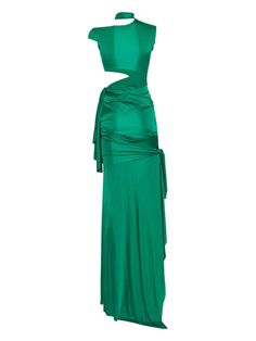 a green dress on a mannequin with one piece cut out and the other part draped