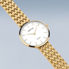 Ladies Titanium  New In: Our new ladies' watches from the Titanium Collection are truly eye-catching. Available in silver, gold and a bicolor look, they are the perfect choice for fashion-conscious women looking for an elegant and robust watch.  The watches are made of high-quality titanium. This material is extremely strong, ultra-light and hypoallergenic. The titanium bracelets fit smoothly and give the watch an elegant and delicate look. The high wearing comfort makes them perfect for daily u Elegant Gold Watch With Polished Finish, Timeless Gold Watch For Everyday, Gold Minimalist Analog Watch, Classic Yellow Gold Analog Jewelry And Watches, Classic Yellow Gold Watch For Everyday, Classic Yellow Gold Watches For Everyday Wear, Elegant Everyday Watch With Polished Finish, Modern Gold Jewelry And Watches, Elegant Yellow Gold Watch For Everyday Wear