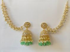 Bahubali Kundan Pearl Jhumka with sahare /Kundan Gold Jhumka/Indian/Pakistani/Punjabi/Statement earring/Bridal earring/Indian wedding Height = 82 mm || Width = 48 mm Bollywood Look Indo Western Earring Ships from California and delivery in 2-5 business days Can be paired with any dress Closure: Pushback This is 100% Handmade jewelry. So Color, shades, texture displayed may slightly vary from the actual product due to digital image limitations. We request you to consider these minor variations. P Traditional Stone Work Jhumkas For Eid, Bollywood Stone Work Jhumkas For Navratri, Bollywood Style Stone Work Jhumkas For Navratri, Festive Hand Set Jhumkas For Party, Eid Chandbali Jhumkas With Tilla, Green Jhumkas For Wedding And Eid, Traditional Green Jhumkas For Wedding, Traditional Green Jhumkas For Eid, Wedding Cutdana Danglers For Eid