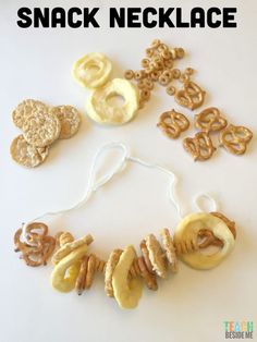 snack necklace made with pretzels, cookies and pretzels on a white background