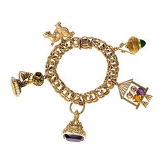 From our estate & antique collection, this vintage double-link charm bracelet features a Victorian-style fob charm with an amethyst stone and ornate engraving in 14K yellow gold. Other charms are sold separately. Heart-shaped button box clasp Length: 7.5" This is a special piece of jewelry from our estate collection. We hope you will enjoy the character and imperfections that are associated with a vintage item. Estate Engagement Ring, Purple Watch, Gemstone Rings Vintage, Vintage Phone, Vintage Inspired Rings, Antique Wedding Rings, Colored Stones, Colored Stone, Purple Stones