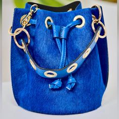 * Cobalt Blue *Measurements: 10" X 8" 1/2 X 6" 1/2 * Material: Genuine Leather * Crossbody Strap Designer Blue Rectangular Bucket Bag, Designer Blue Bucket Bag With Dust Bag, Luxury Blue Bucket Bag For Daily Use, Designer Blue Bucket Bag, Blue Luxury Pouch Bucket Bag, Luxury Blue Pouch Bucket Bag, Blue Formal Bucket Bag, Formal Blue Bucket Bag, Luxury Blue Bucket Bag With Adjustable Strap