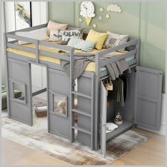 a child's loft bed with stairs and storage underneath the bed is made from grey wood