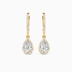 Add elegance to any outfit with these sumptuous earrings. Each drop features a pear-cut stone encrusted inside a sparkling halo, completing the look of this trendy pair. These perfect earrings make you become the center of attention.Carat Weight: 2 ctStone Size: 5*8 mmStone Type: Moissanite/GemstoneNumber of Stones: 2 Stone Shape: PearStone Color: OptionalCarat Weight: 0.32 ctStone Size: 1 mmStone Type: Moissanite/GemstoneNumber of Stones: 64 Stone Shape: RoundStone Color: OptionalWidth: 7.4 mmH Always Here For You, Center Of Attention, Pear Cut, Personalized Jewelry, Solid Gold, Pear, Platinum, Jewelry Earrings, Sparkle