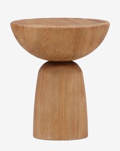 a small wooden stool sitting on top of a white floor