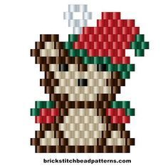 a cross stitch christmas ornament with a snowman on it's head