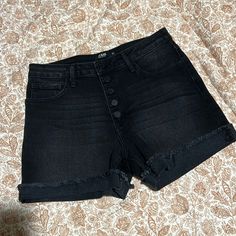 Never Worn -Like New. High Waist Women’s Jean Shorts. Black With A Slight Wash. Button Up, No Sip. Stretchy Fabric. Summer Black Bottoms With Button Closure, Casual Black Button-up Bottoms, Casual Black Shorts With Button Closure, Black High-waisted Jean Shorts For Summer, Black High Waist Shorts With Buttons, Black High-waisted Shorts With Buttons, Black High Rise Shorts With Button Closure, Black Jean Shorts With Button Closure, Stretch Mid-rise Black Jean Shorts