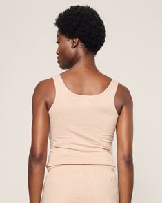 At the tippy top of the cotton jersey pecking order is 100% Peruvian Pima cotton. Our Pima Collection is sewn from this exquisite fabric: luxurious, supple jersey knit tank that drape beautifully and continue to soften with each washing. Buttery and smooth, yet breathable, this collection is yarn-dyed to prevent fading and is destined to become a fixture of your soothing bedtime ritual. Modal Tops With Built-in Bra For Loungewear, Beige Stretch Vest Top, Stretch Cotton Vest In Beige, Beige Cotton Stretch Vest, Beige Cotton Camisole With Tank Straps, Versatile Seamless Cotton Tops, Fitted Sleeveless Organic Cotton Top, Versatile Fitted Beige Tank Top, Beige Stretch Cotton Vest