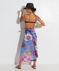 Go beyond the beach with this investment-worthy style in a stunning botanic print and elevated fabric that drapes beautifully! A sarong scarf (also known as a pareo) is a classic summer cover-up that is the epitome of versatility. Worn casual or chic, this beach-ready essential can be a dress, a skirt, or a scarf. Dimensions: 42" x 70" Materials: 80% cotton / 20% silk Made in: India ​ Bohemian Tropical Print Sarong For Pool, Bohemian Sarong With Tropical Print For Pool, Floral Print Wrap Beachwear Cover-up, Bohemian Printed Sarong For Pool, Summer Pool Sarong With Tropical Print, Tropical Wrap Sarong For Vacation, Tropical Style Wrap Sarong For Vacation, Bohemian Sarong With Tropical Print For Beach Season, Floral Print Sarong For Beach Cover-up