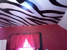 there is a zebra print ceiling in the room