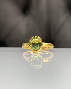 Natural Peridot Ring * Dainty Cabachon Ring * Genuine Peridot & 14K Solid Gold * Best Gift for Her/Him * Handmade Ring ◎ Details ◎ ○ Gemstone Details .Natural PERIDOT Oval Cut 9X7 mm approx. 2.01 ct ○ Gold Details 14K Solid Gold Width of Band : 2.50 mm Weight of Ring : approx 3.80 gr Made to Order HANDMADE ITEM ○ Upgrade to Solid 18K Gold, please click the link below: https://www.etsy.com/listing/962826004 For more CABACHON BEZEL rings : http://etsy.me/37fvI60 ○ PERIDOT RINGS : https://etsy.