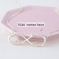 ♥ Infinity Necklace with Names ♥ A dainty infinity name necklace - perfect to wear everyday and makes a wonderful gift!• Material: Solid 925 Sterling Silver • Finishing: Silver - Yellow Gold - Rose Gold • Dimensions: approx. 1 1/2" x 3/8"• Character limits: max 4 names (8 characters/name)• Necklace length: You can choose up to 24 inches (includes pendant's length)H O W • T O • O R D E R1. Please select your preferred COLOR from the menu. 2. Please select your preferred chain length from the menu Silver Name Necklace For Gifts, Personalized Silver Necklace For Gifts, Customizable Silver Necklace For Valentine's Day, Customizable Silver Jewelry For Christmas, Personalized Silver Name Necklace For Christmas, Customized Silver Name Necklace For Christmas, Custom Name Silver Jewelry For Christmas, Personalized Silver Charm Necklaces For Christmas, Personalized Silver Charm Necklace For Christmas