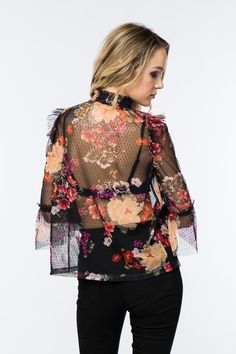 Timing Fashion Sheer mesh floral blouse, ruffled shoulder and elbow accented with bell. 3/4 sleeves. High shirred collar. No cami or lining included.Color: Black Multi Sizes: S-M-L Bust 36-38-40, Length 23100% Polyester, hand wash, imported M2/MT21115 Summer Blouse With Stretch Mesh Sleeves, Fitted Floral Print Top With 3/4 Sleeves, Spring Blouse With Long Mesh Sleeves, Feminine Tops With Sheer Sleeves For Fall, Feminine Fall Tops With Sheer Sleeves, Chic Spring Blouse With Mesh Sleeves, Spring Chic Blouse With Mesh Sleeves, Fitted Blouse With Floral Print And 3/4 Sleeves, Fitted Floral Print Blouse With 3/4 Sleeves