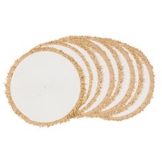 six white and gold placemats with fringe on them, arranged in the shape of a circle