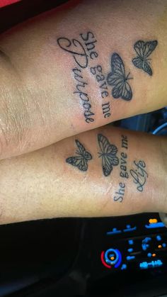 two people with butterfly tattoos on their arms