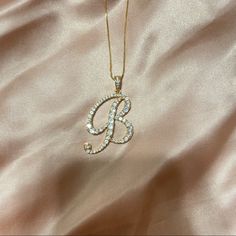 Gold Rhinestone Initial Necklaces With A Lobster Clasp Closure. Cz (Cubic Zirconia) Pave Pendent Necklace With A Fully Embellished Letter. All Rhinestones Are Intact. Necklace Length Measurement 18.5”-21”. More Letters Available!!! Doesn’t Come In A Box. ***Also Available In Silver*** Approx Length: 22 Made In Korea B Pendant Necklace, Initial Pendant Necklace B, C Letter Necklace, B Necklace Initial, Good Necklace Jewellery, Elegant Personalized Rhinestone Necklace Gift, Elegant Personalized Rhinestone Necklace For Gift, Elegant Gold Iced Out Rhinestone Necklace, Iced Out Diamond Rhinestone Necklace Gift