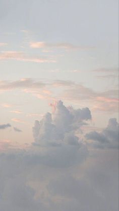 two airplanes flying in the sky at sunset