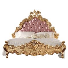 an ornate gold bed frame with pink velvet upholstered headboard